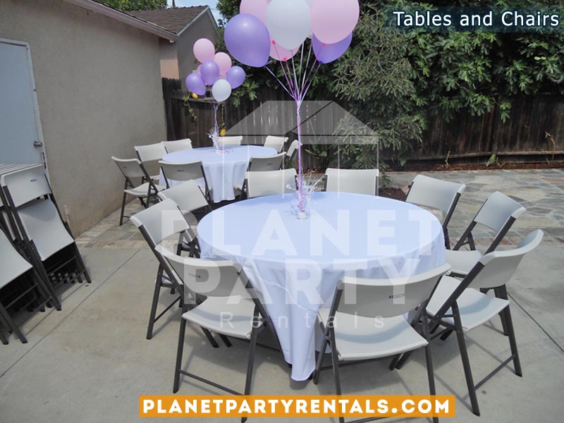 Round Tables with Table Cloth and White Chairs